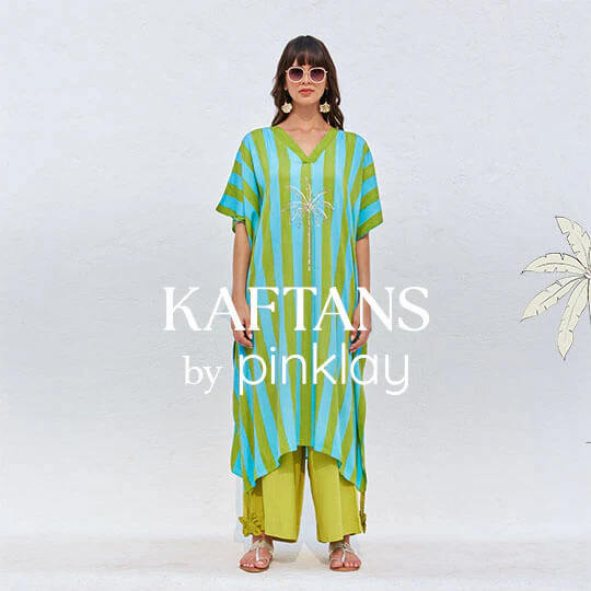 A woman wearing a bright, floral-patterned kaftan.