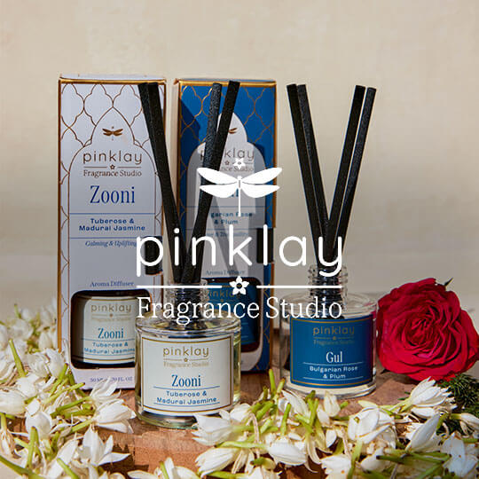 A scented candle from the Fragrance Studio collection.