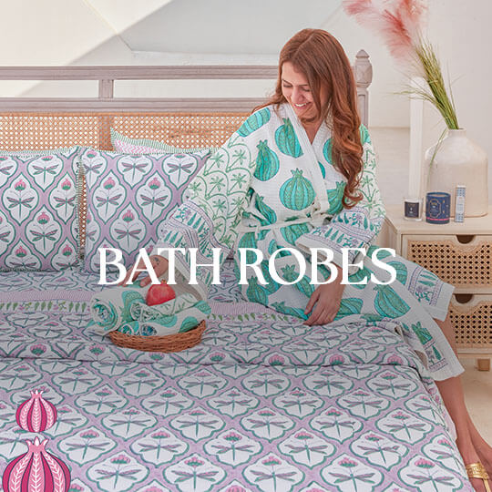A woman wearing a white and blue patterned bath robe.